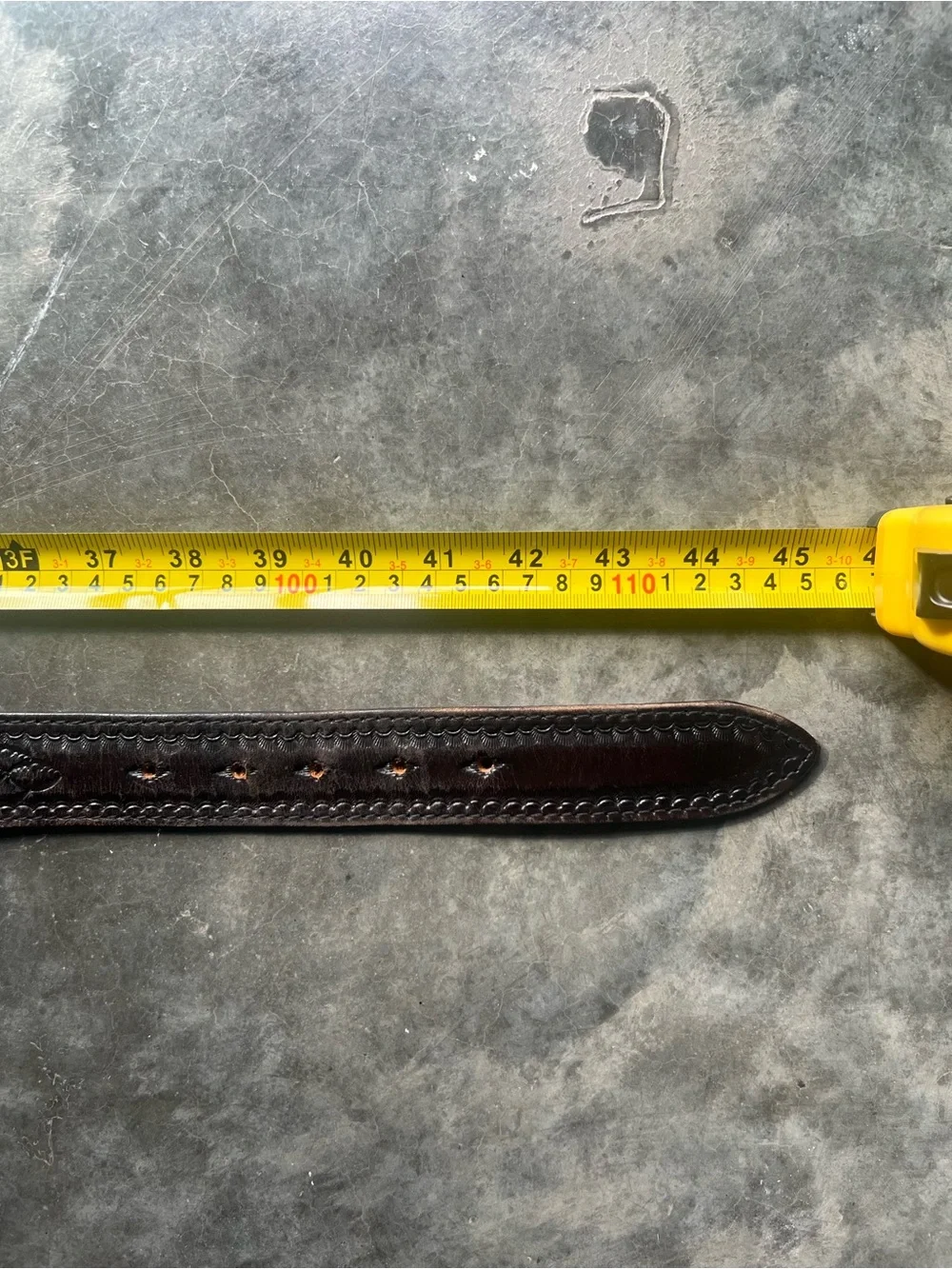 Vintage Levi's black tooled leather western belt with rotating harness buckle